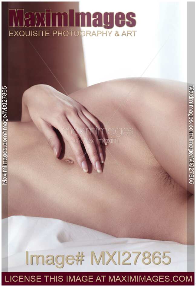 Closeup of nude woman body in bed