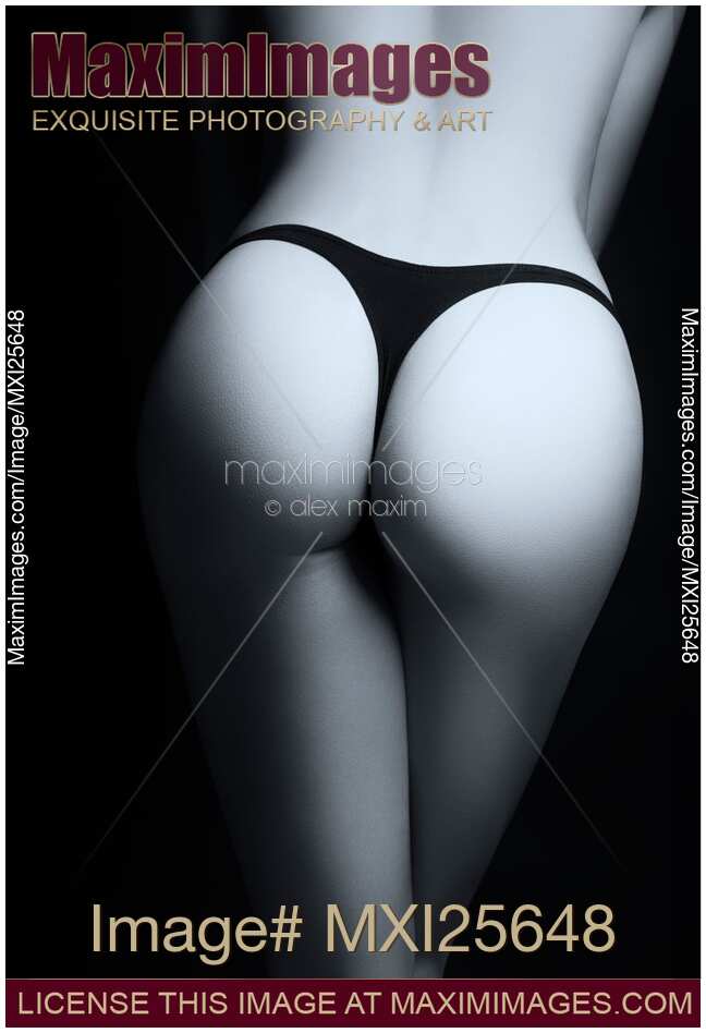 Closeup of sexy woman butt in black thongs Black and white