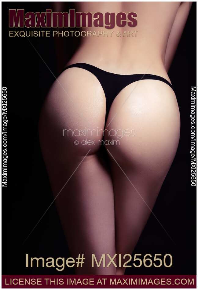 Closeup of sexy woman butt in black thongs