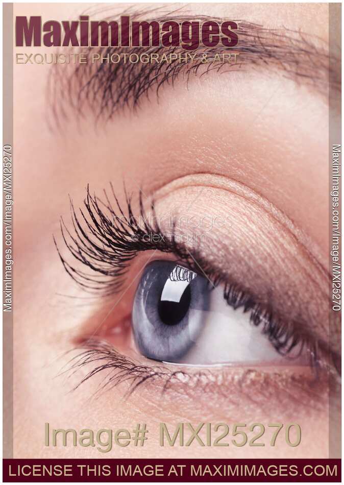 Closeup of woman blue eye with long eyelashes