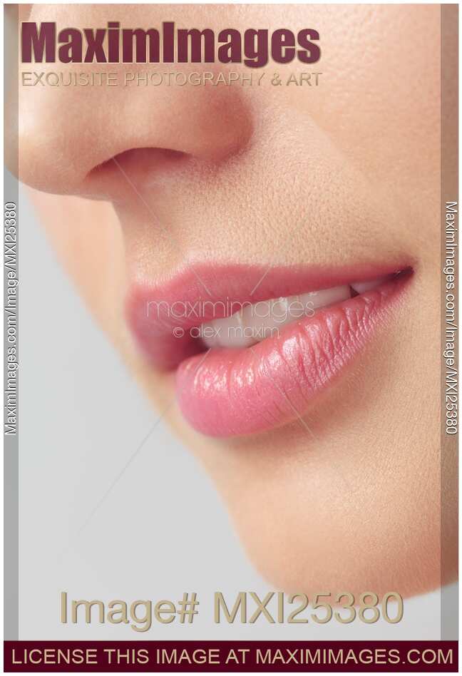 Closeup of woman mouth with pink lips