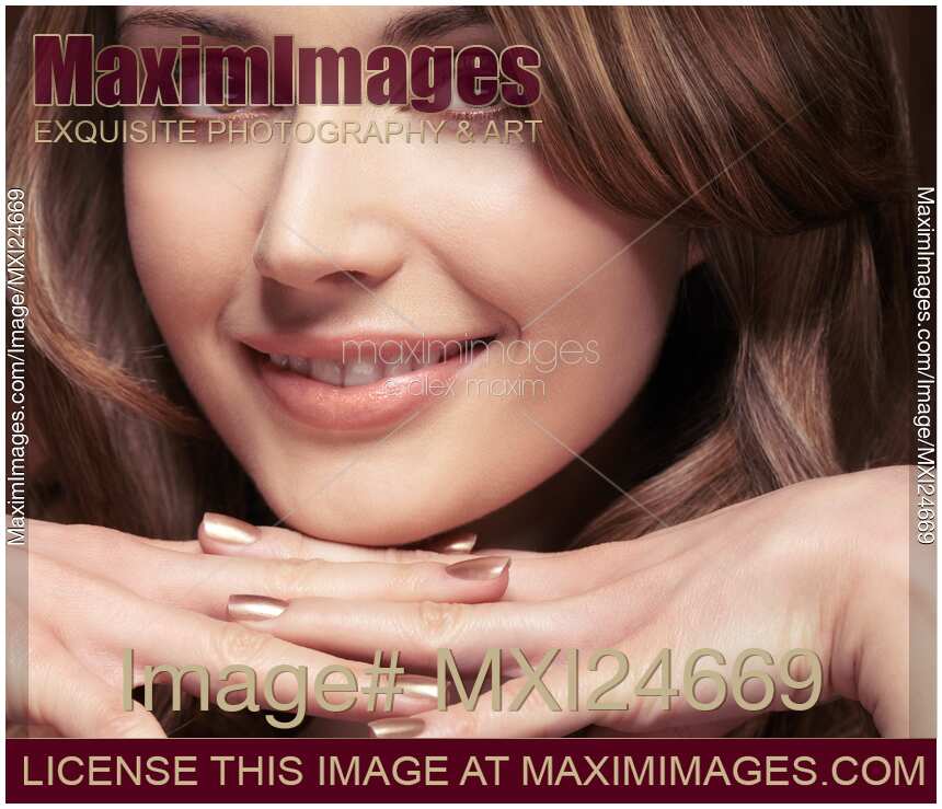 Closeup portrait of a beautiful smiling young woman