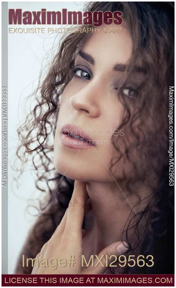 Closeup portrait of a young woman with deep expressive sensual look