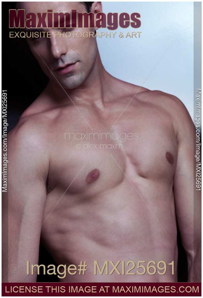 Closeup portrait of sexy young man with bare torso