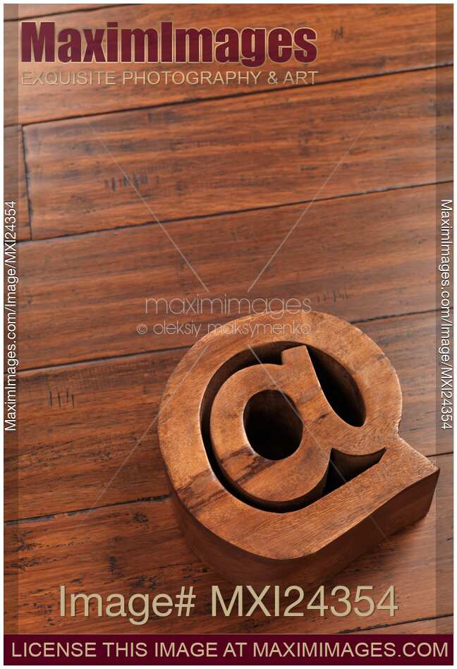 Contact and email symbol AT made of wood