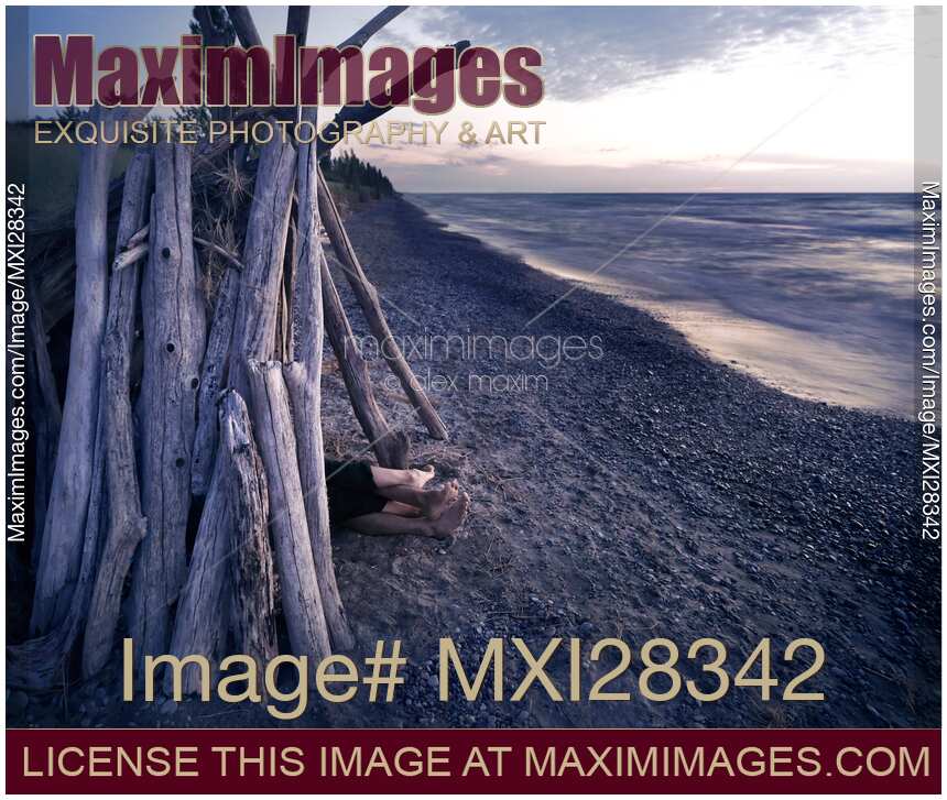 Couple in driftwood shack at the beach