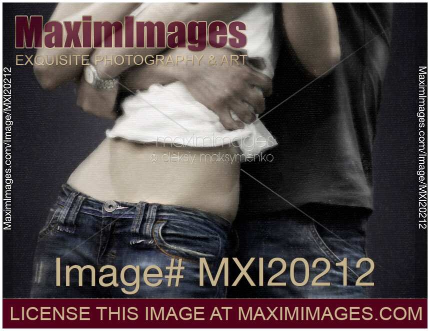 Couple in jeans man grabbing young woman