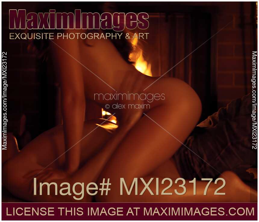 Couple Making Love at a Fireplace