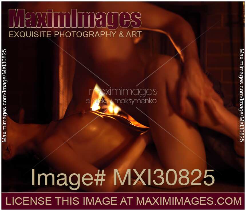 Couple Making Love at a Fireplace