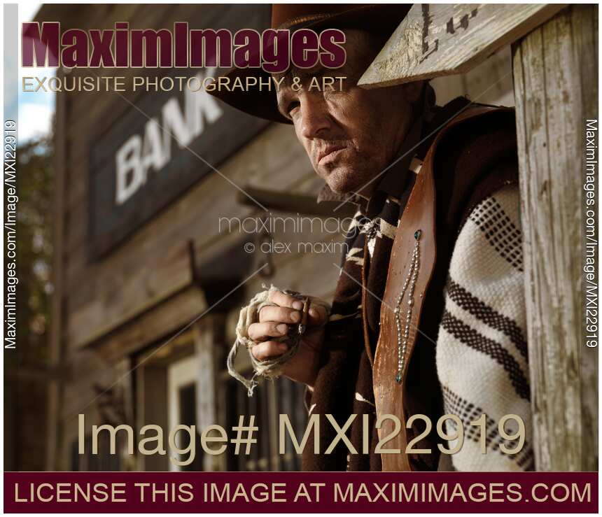 Cowboy Smoking a Cigar Outside of a Bank Building