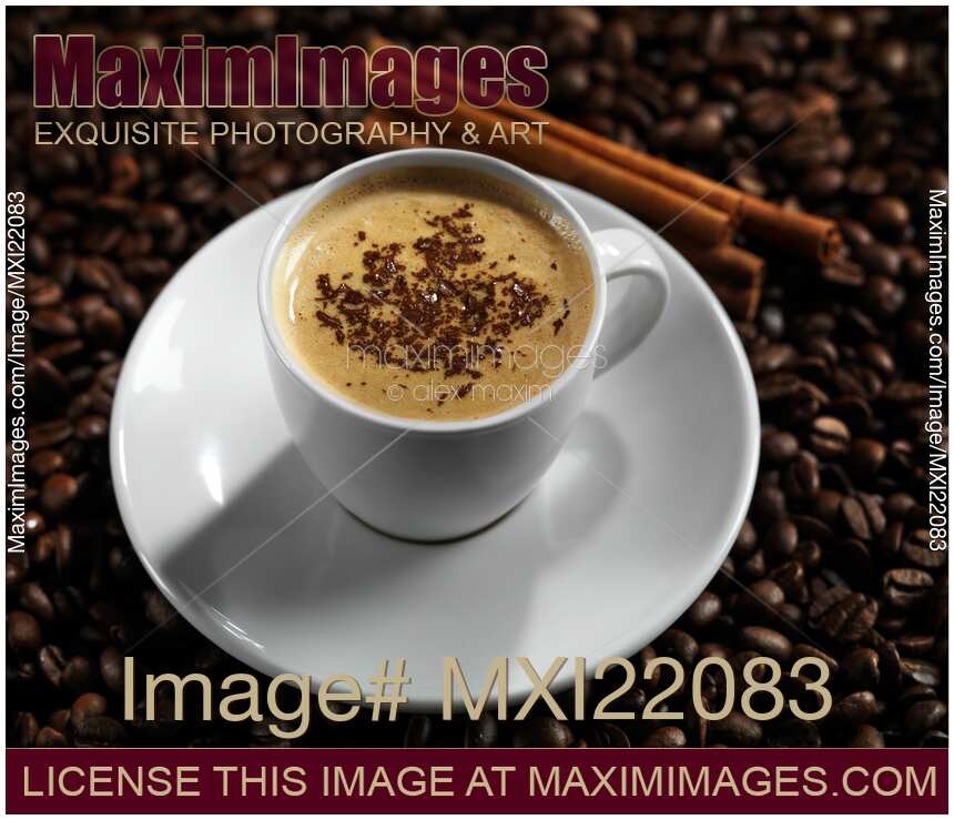 Cup of Coffe Latte on Coffee Beans