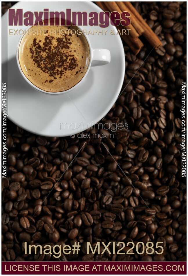 Cup of Coffe Latte on Coffee Beans