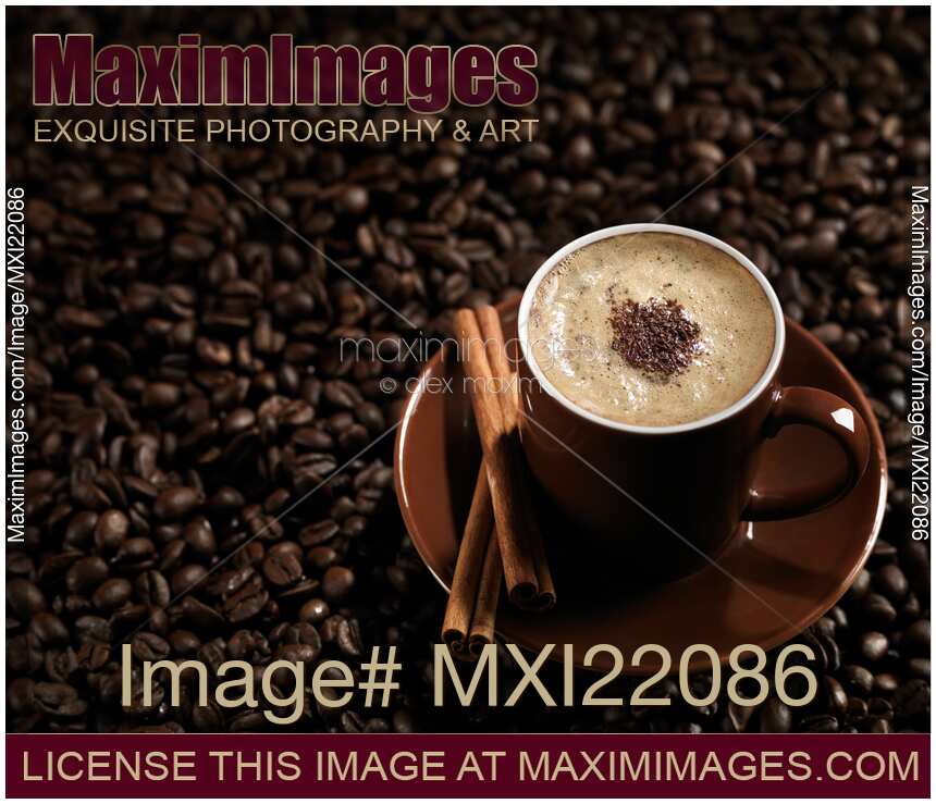 Cup of Coffe Latte on Coffee Beans