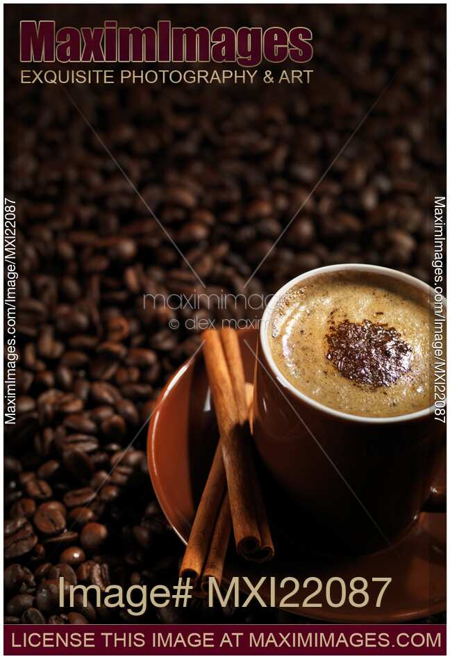 Cup of Coffe Latte on Coffee Beans