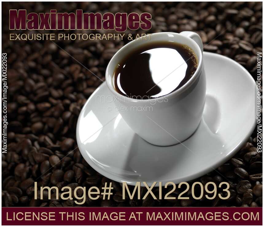 Cup of Coffe on Coffee Beans