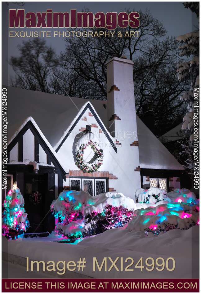 Cute family house decorated with Christmas lights