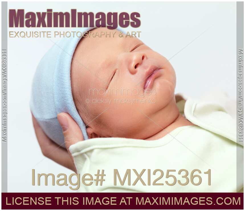 Cute newborn baby boy closeup portrait