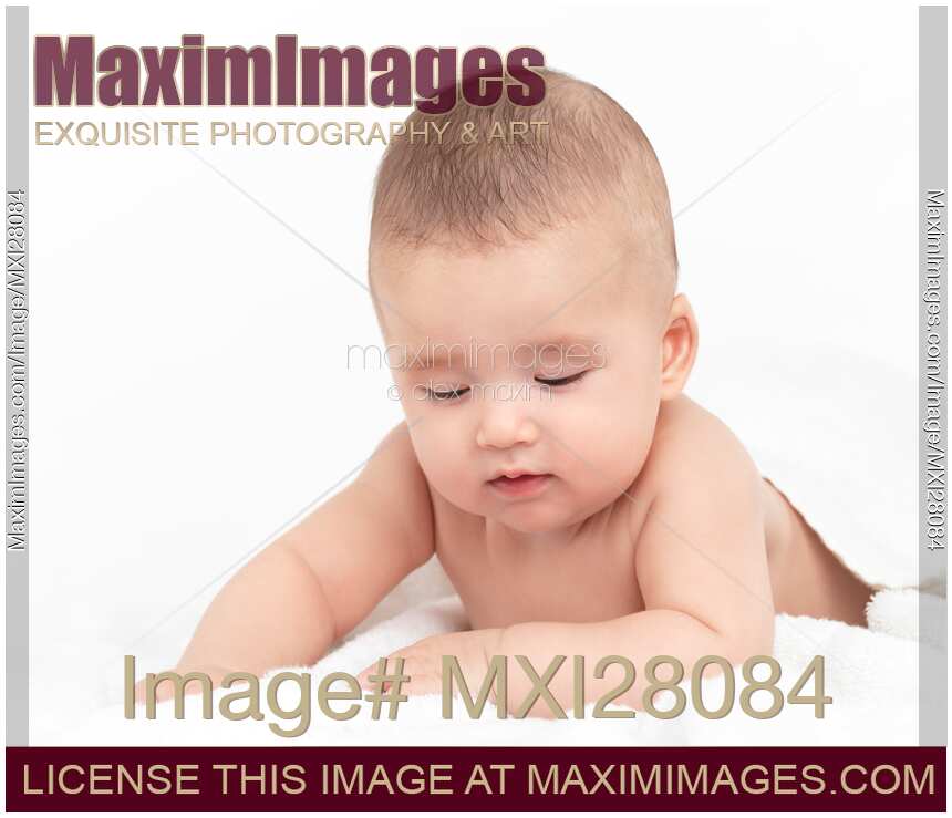 Cute thoughtful baby looking down