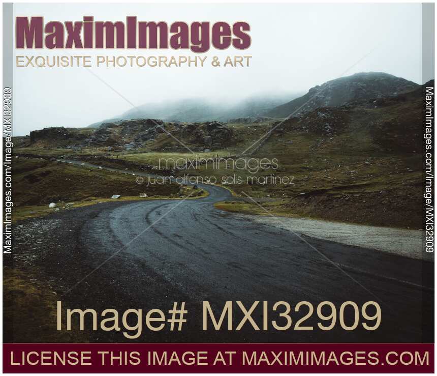 Dark moody winding road in Sligo Ireland dramatic misty landscape