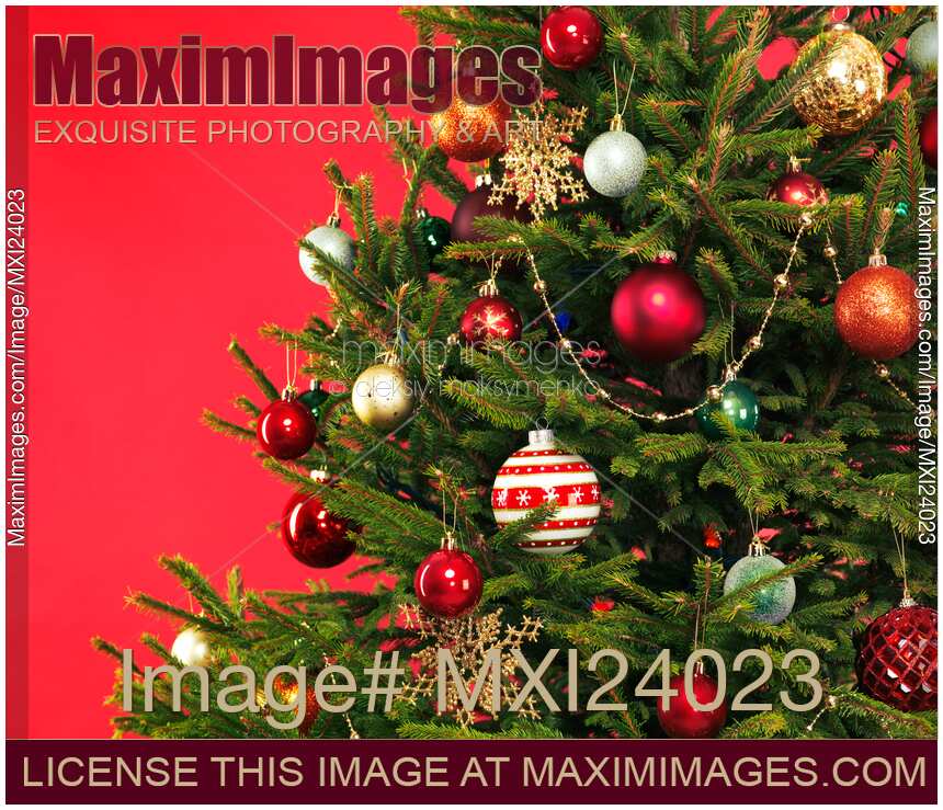 Decorated Christmas tree on red background