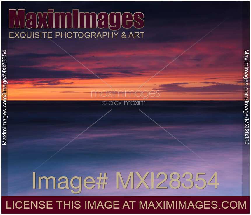 Dramatic abstract red and blue sunset scenery of lake Huron