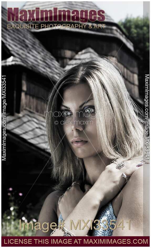 Dramatic expressive portrait of a young woman with ghostly gray eyes and a possessed or astonished look