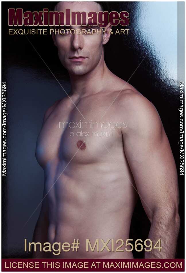 Dramatic portrait of a sexy young man with bare torso