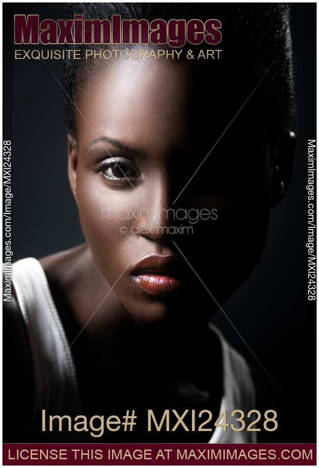 Dramatic portrait of a young black african american woman face