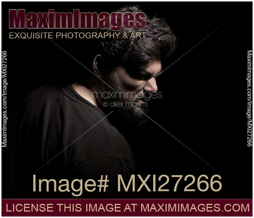 Dramatic portrait of angry middle aged man