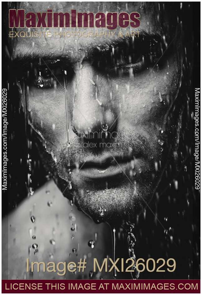 Dramatic portrait of man wet face Black and white