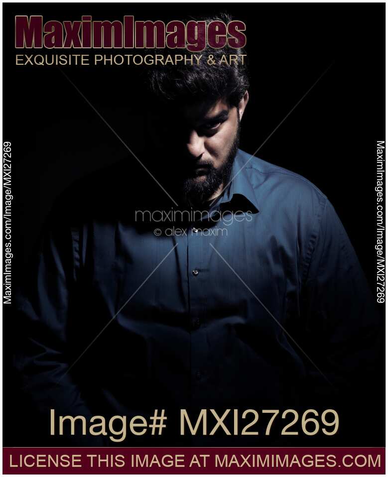 Dramatic shadowy portrait of a man