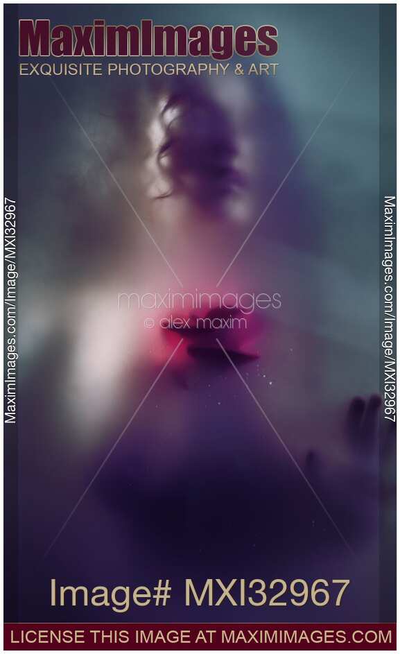 Dream-like ghostly sensual woman face with red rose behind a blurry glass Love and suffering