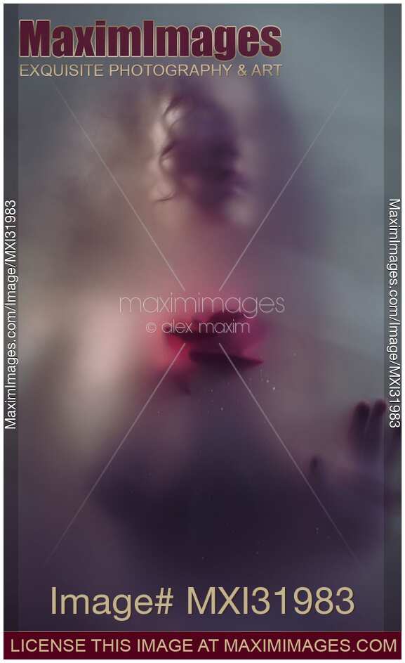 Dream-like ghostly sensual woman face with red rose behind a hazy foggy glass fine art portrait