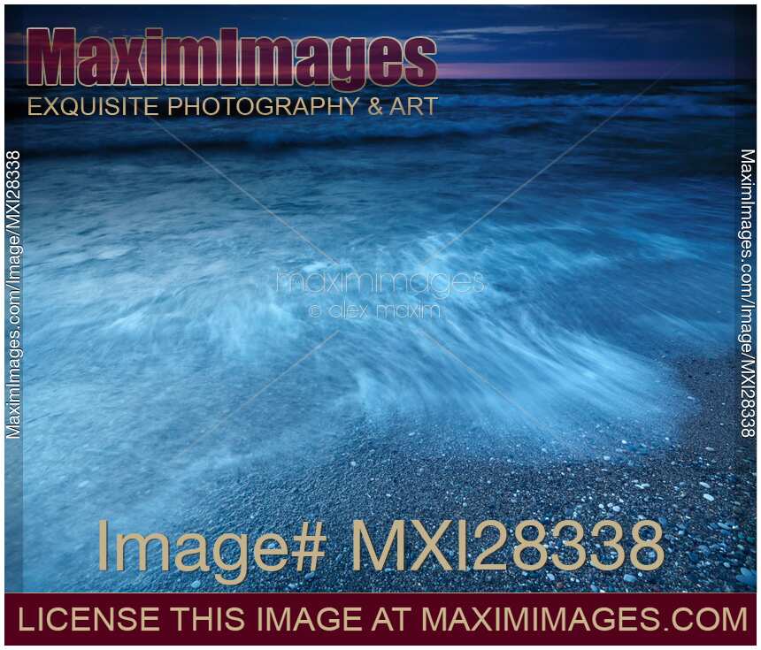 Dusk nature scenery of waves on the shore of lake Huron