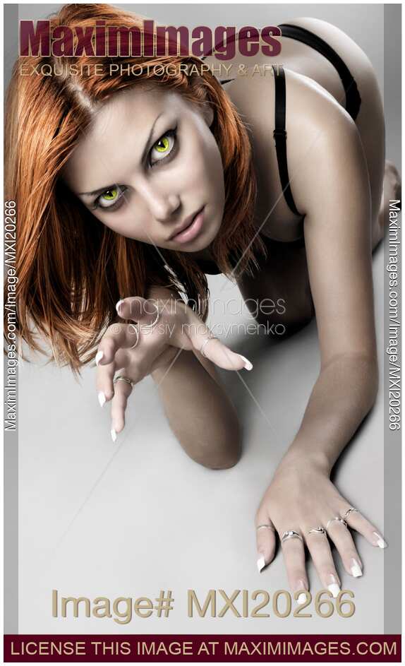 Edgy glamour portrait of sexy woman with cat eyes