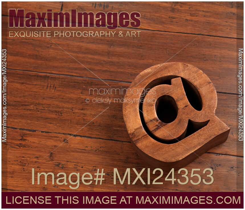 Email symbol at made on hardwood floor
