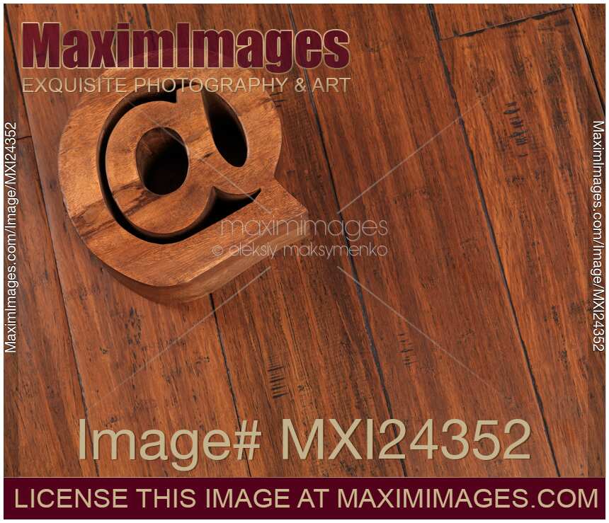 Email symbol at made on wooden floor
