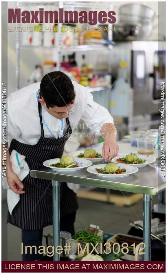 Executive Chef Quang Dang garnishing a gourmet competition meal at BC Seafood Festival