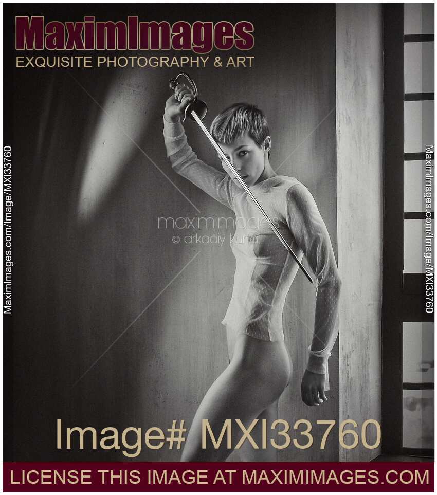 Expressive portrait of a half nude woman with short hair holding a fencing sword
