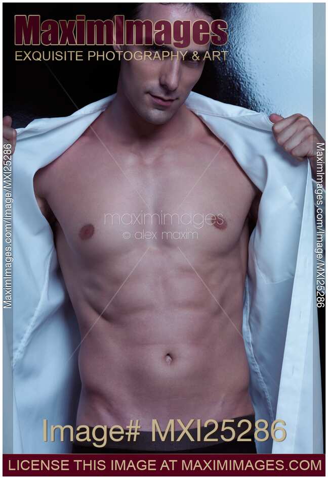 Expressive portrait of a man taking of his shirt
