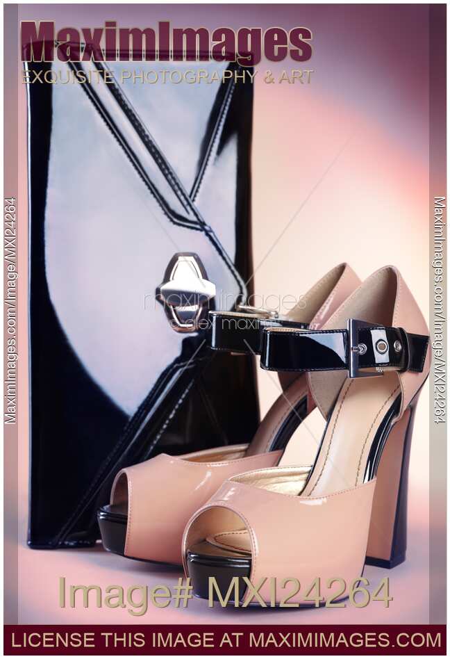 Fancy high heel shoes and a hand bag still life