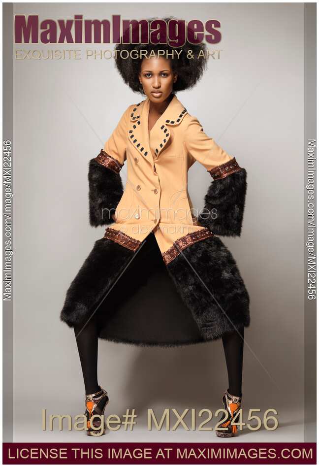 Fashion Model Wearing a Coat with Fur