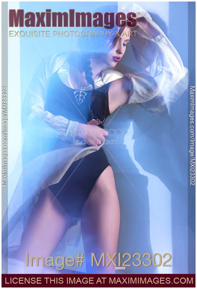 Fashion Photo of a Woman Wearing Swimsuit in Shining Blue Light
