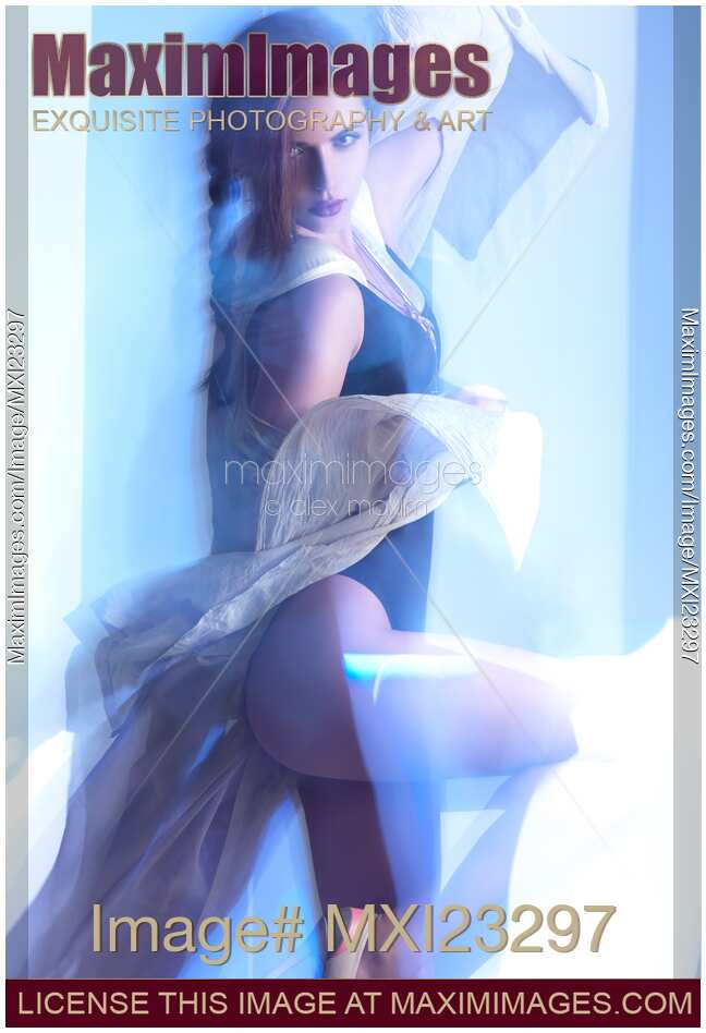 Fashion Photo of Woman Dancing in Blue Light