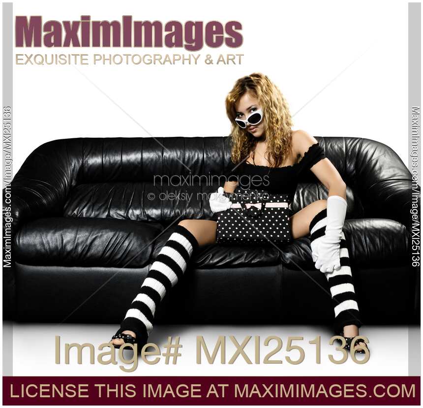 Fashionable Woman on a Couch