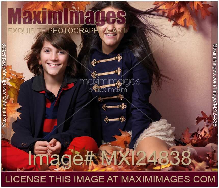 Fashionably dressed boy and teenage girl artistic fall fashion