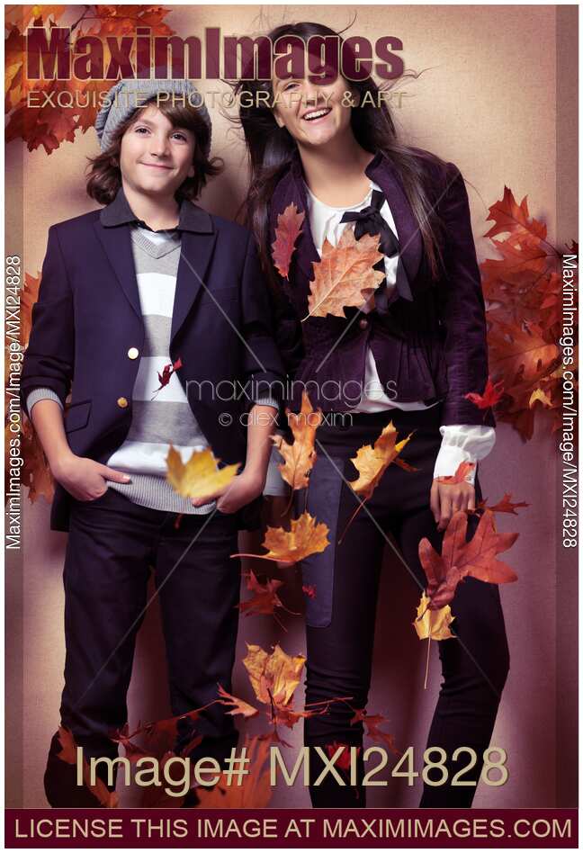 Fashionably dressed boy and teenage girl fall fashion