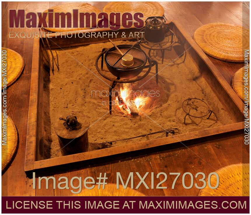 Food being cooked on fire in Japanese historic house