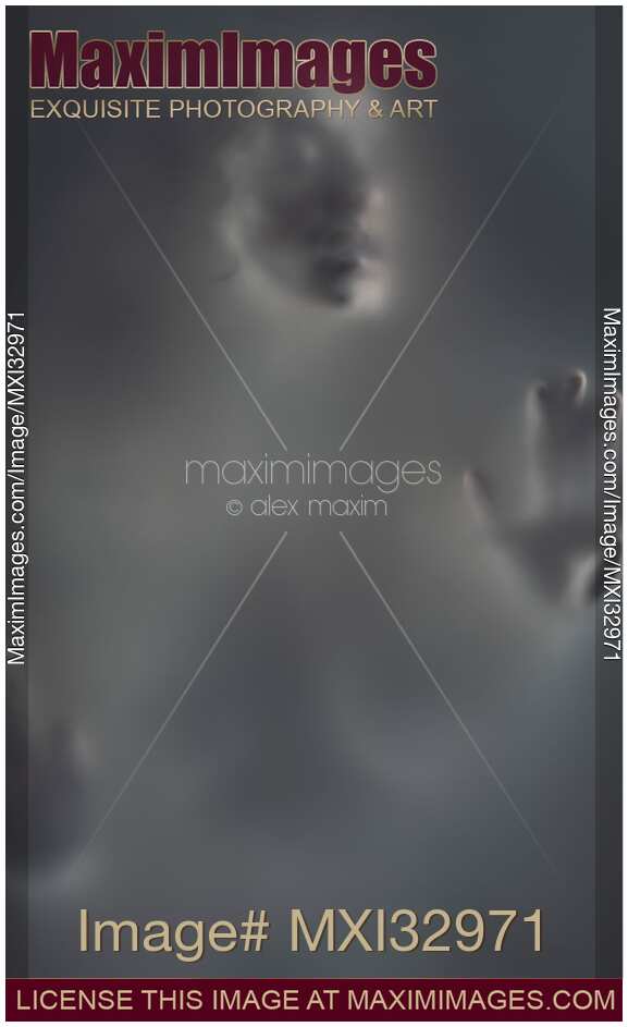 Ghostly gray woman face behind a hazy blurry suffocating fog Suffering and sensuality fine art concept