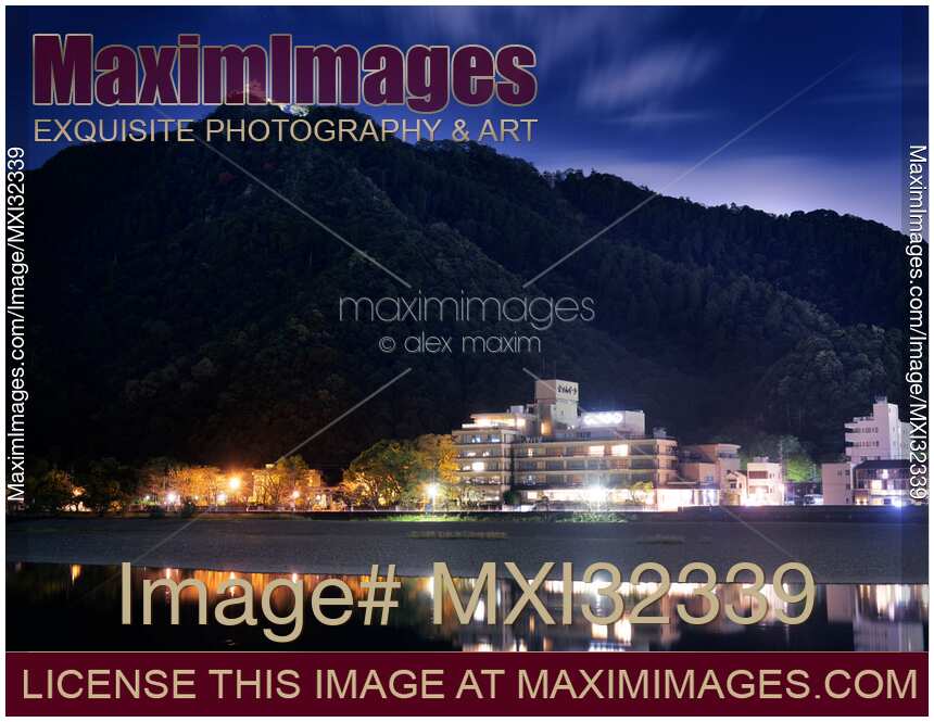 Gifu Castle Gifu-jo illuminated at night on top of Mount Kinka Kinka-zan under dark blue twilight sky City of Gifu Japan